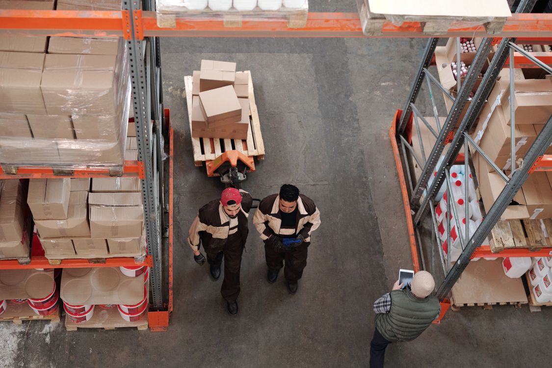 Warehouse team preparing boxed inventory for shipment